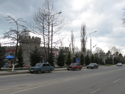 More fake castle walls in Ismayilli, here quite an extreme example, just surrounding a residential area. Also, the old Russian Lada cars like the two that can be seen in this photo are very very common here.
