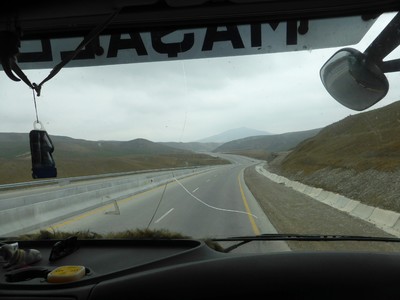 To avoid an impending storm, we hitchhiked on a truck from Shamakhi to Baku. Our original plan was just to hitchhike to Gobustan Maraza and then roll downhill from there, but the driver was heading to Baku anyway so we just sat all the way. On the way to Baku, the landscape gradually turned from green to brown.