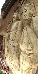 Maijishan Grottoes. This 15.7m high Buddha, attended on both sides by Bodhisattvas, is the largest statue in Maijishan. Built in the Sui Dynasty (581-618 AD) and rebuilt in the Song Dynasty.