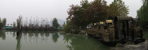 Lake in Wuhou Ancient Town, where two battle scenes from the Three Kingdoms period have been recreated: the Battle of Red Cliffs (赤壁) on the left, and Borrowing Arrows with Straw Boats (草船借箭) on the right. The ancient town is filled with reconstructed buildings from the time and life of Zhuge Liang, a famous chancellor and regent of one of the Three Kingdoms, the Shu Han state. He was conferred the title of Wuhou ("Marquis of Wu") by the Shu Emperor for his devotion and service.