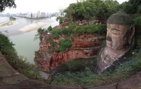 Leshan Giant Buddha, carved into the cliff face at the confluence of the Min and Dadu rivers, across from the city of Leshan. The statue, depicting a seated Maitreya Buddha, was built between AD 713 and AD 803, during the Tang Dynasty. At 71m tall, it is the largest stone Buddha statue in the world.