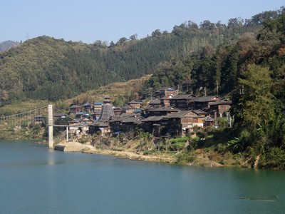 Dong village on the opposite side of the Duliu river on the way from Rongjiang to Congjiang, with a drum tower in the middle
