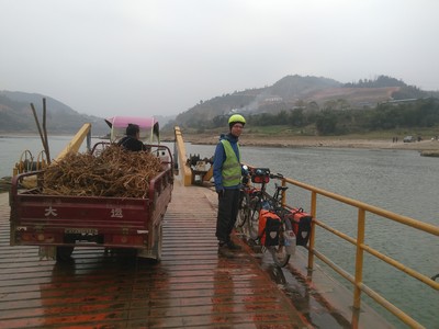 Somewhere after Congjiang, we followed the road sign to Sanjiang that led us across a bridge onto a brand new road with very little traffic on the other side of the Duliu river. We followed this road for over 12km (after confirming with some workers that the road did lead to Sanjiang) only to reach a dead end at another bridge (over a tributary) that was still under construction. Thankfully, we found this ferry crossing the Duliu river in the village near where our road ended, taking us back to the old road on the other side and saving us a long detour.