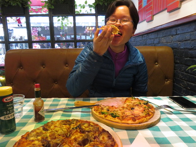 Pizza! Our Christmas lunch in a restaurant on West Street in Yangshuo (also known as "Foreigners' Street", because of the large number of foreign tourists here). Might not seem like anything special, but we actually can't remember the last time we had pizza (at least, not since we left Europe a year ago).