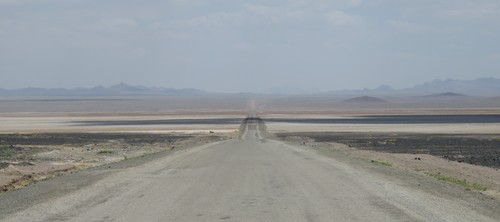 The long and straight road through the desert between Varzaneh and Nodoushan. The mountains in the distance are about 20km away.