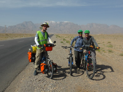 Our hosts Ali & Sara cycling with us towards the snow-covered mountains near Mehriz. They were cycling up the mountains, while we were continuing on the road to Tang-e Chenar, and we were too slow for them, so we parted here.