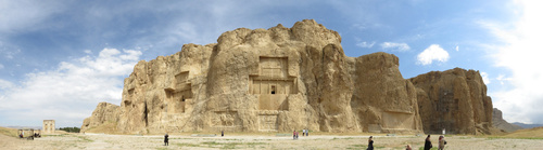 Naqsh-e Rustam, the necropolis of the Achaemenid empire, with four large tombs cut high into the cliff face. The tombs are believed to be those of Achaemenid kings (from left to right) Darius II, Artaxerxes I, Darius I, and Xerxes I.