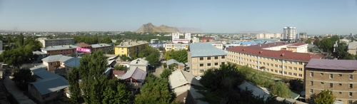 Panorama of Osh from our Airbnb apartment, with the iconic Sulaiman Too mountain rising up in the middle of the city