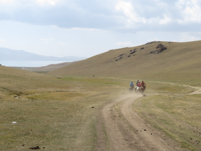 Horse trekking to Song-Kul lake - riding down to the lake