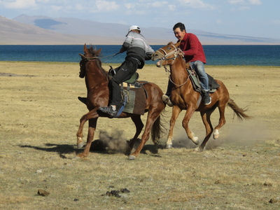 Our guides playing "kok boru", a Kyrgyz traditional horse game, after arriving at Song-Kul lake on our horse trek