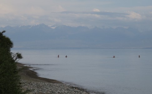People swimming in Issyk-Kul lake near our campsite between Cholpon-Ata and Karakol