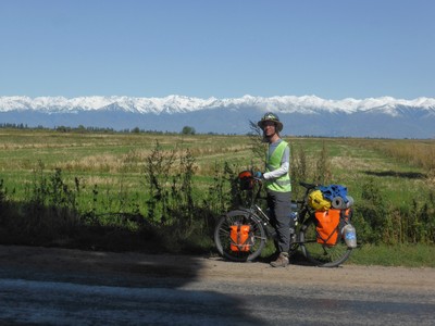 Our day cycling out of Karakol was blessed with clear skies and this amazing, omnipresent view of the Kungey Ala-Too range of the Tien Shan mountains, that forms the border between Kyrgyzstan and Kazakhstan. It had rained heavily the day before, and also snowed heavily in the mountains, making the majestic snow-capped peaks look even closer than before.
