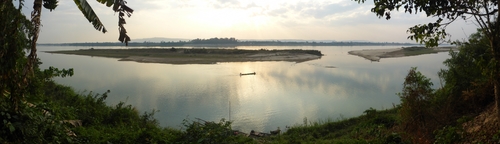 Evening on the Mekong river between Vieng Kham and Pakkading. Recent hydropower developments have caused the colour of the river to change from a very muddy brown to clear blue.