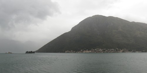 Perast, a village built entirely in baroque style and set into the steep mountainsides of the Bay of Kotor, is a UNESCO World Heritage Site. On the left are the islets of Our Lady of the Rocks and St. George.