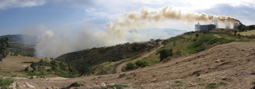 Factory at the top of the tunnel bypass between Dushanbe and Nurak, spewing thick toxic-looking smoke into the valley and villages below