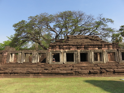Hannah looking out a window of the gallery, that surrounds the inner sanctuary on all sides, of Prasat Hin Phimai, part of the Phimai Historical Park