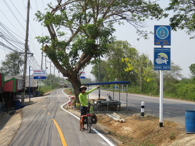 Taking the "scenic route" on a nice, new bicycle lane along the coast between Phetchaburi and Cha-am. We love the Department of Rural Roads!