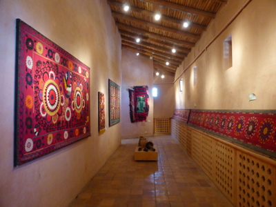 Traditional carpets and embroidered cloths on display in the museum at the Boysun Crafts Centre